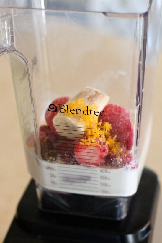 The ingredients for the Creamy Dreamy Strawberry Breakfast Smoothie in a blender