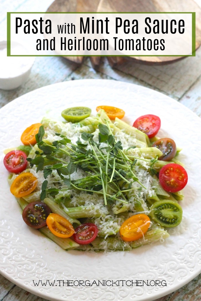 Pasta with Mint Pea Sauce and Heirloom Tomatoes on a white plate