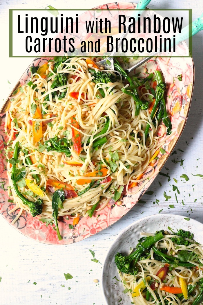 A pink platter overflowing with Linguini with Rainbow Carrots and Broccolini