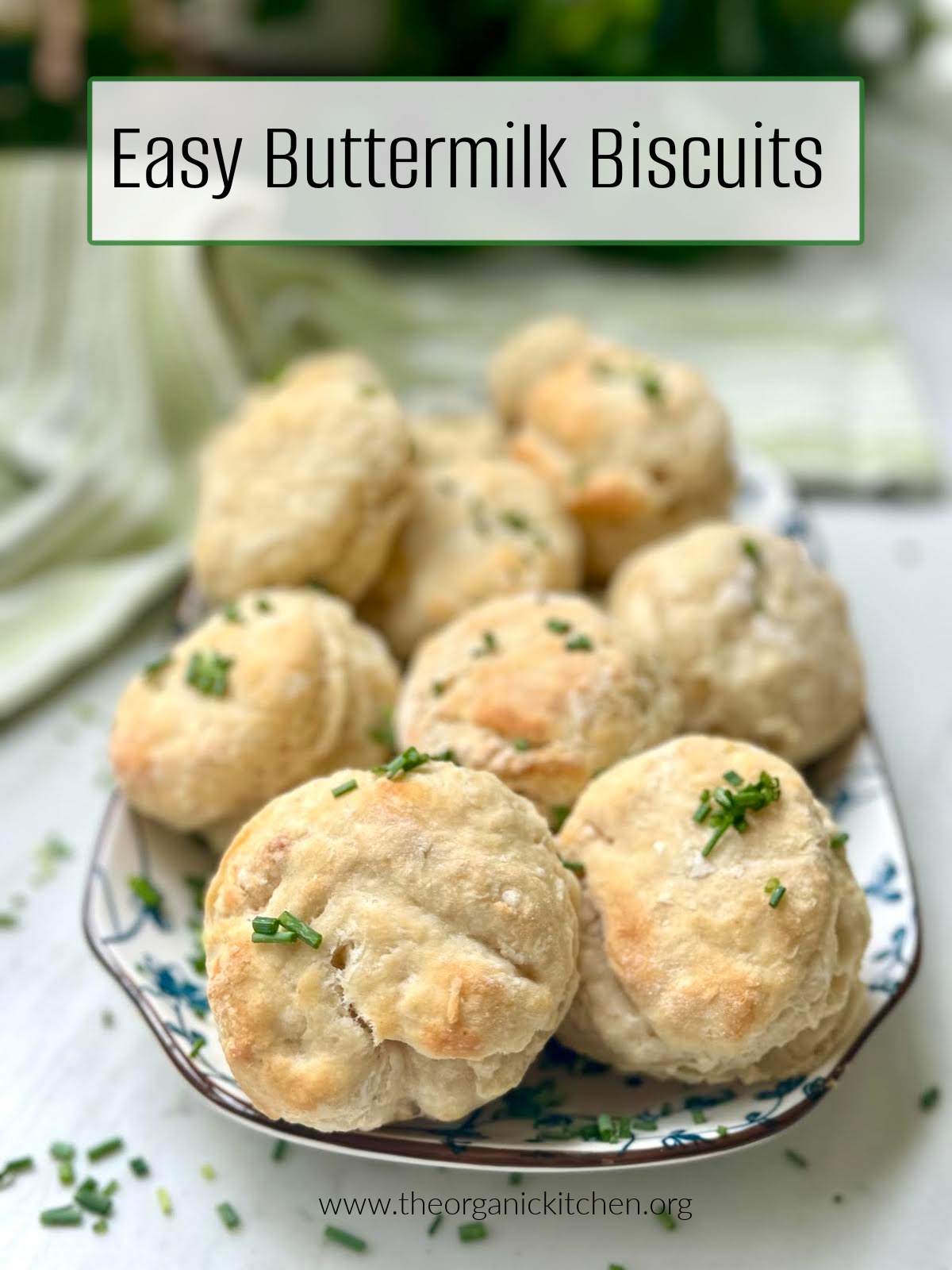 Easy Buttermilk Biscuits garnished with chives on blue and white plate