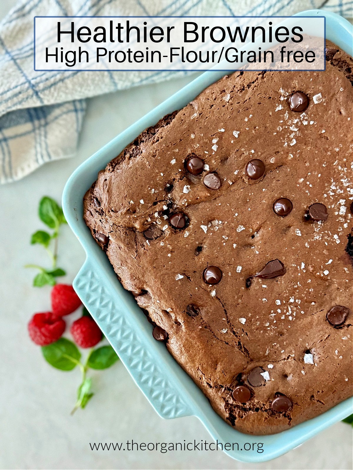 Healthier Brownies (High Protein-Gluten/Grain Free) in blue baking dish with blue and white dish towel in background